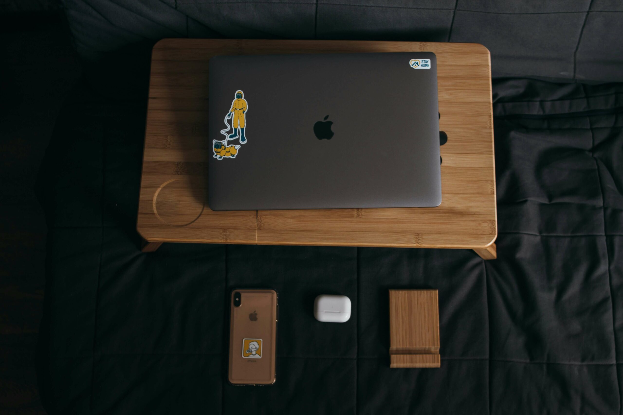 laptop on bed for incoming outsourced work